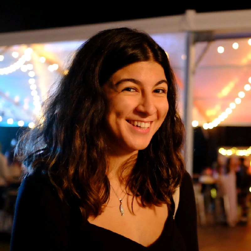 A photo of Naila smiling.