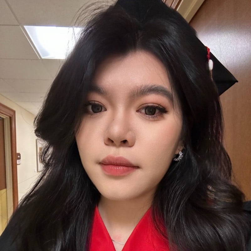 A photo of Jiarun Dai in a graduation cap.